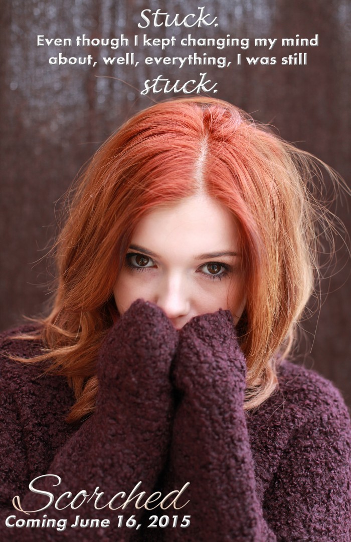 Portrait of a pretty teenage girl with redhaircovering her face with her hands